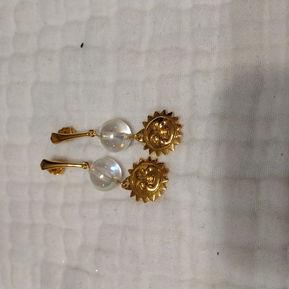 Vintage Avon from before 2000, earrings smiling sun with clear beads.